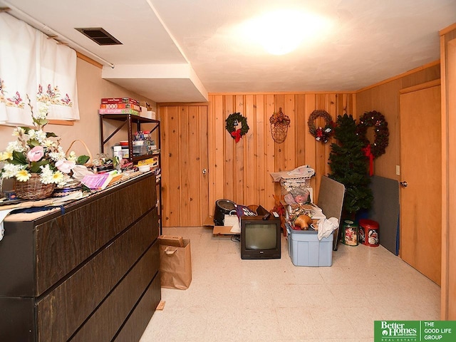 1609 N 71st St, Lincoln, NE 68505 - bedroom with wood walls and tile patterned floors