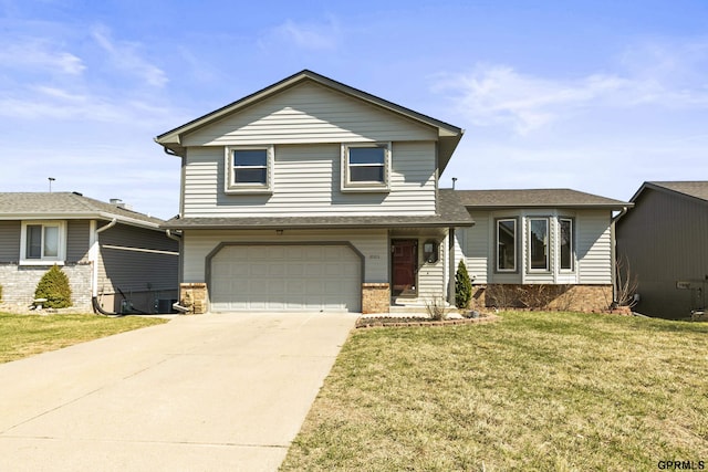 10103 S 11th St, Bellevue, NE 68123 - view of front of property with an attached garage, a front yard, concrete driveway, and roof with shingles