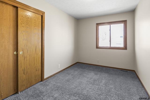 10103 S 11th St, Bellevue, NE 68123 - unfurnished bedroom featuring carpet, a closet, and baseboards
