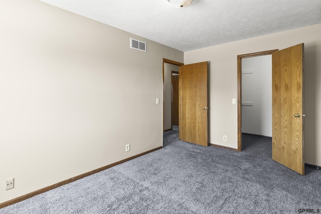 10103 S 11th St, Bellevue, NE 68123 - unfurnished bedroom with carpet flooring, a walk in closet, and baseboards