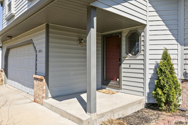 10103 S 11th St, Bellevue, NE 68123 - entrance to property featuring a garage and covered porch