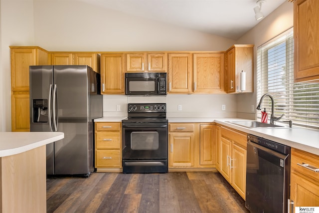 3015 N 144th Ter, Omaha, NE 68116 - kitchen featuring black appliances, a sink, lofted ceiling, light countertops, and dark wood-type flooring
