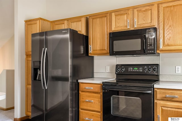 3015 N 144th Ter, Omaha, NE 68116 - kitchen with black appliances and light countertops