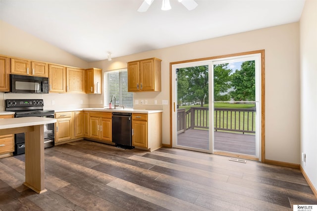 3015 N 144th Ter, Omaha, NE 68116 - kitchen featuring black appliances, light countertops, dark wood-style flooring, lofted ceiling, and a sink