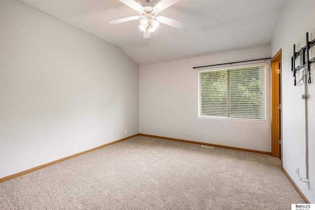 3015 N 144th Ter, Omaha, NE 68116 - spare room with carpet floors, vaulted ceiling, baseboards, and ceiling fan