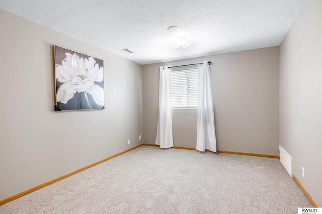 3015 N 144th Ter, Omaha, NE 68116 - unfurnished room featuring carpet floors, baseboards, and a textured ceiling