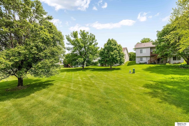 3015 N 144th Ter, Omaha, NE 68116 - view of green lawn featuring stairs and a deck