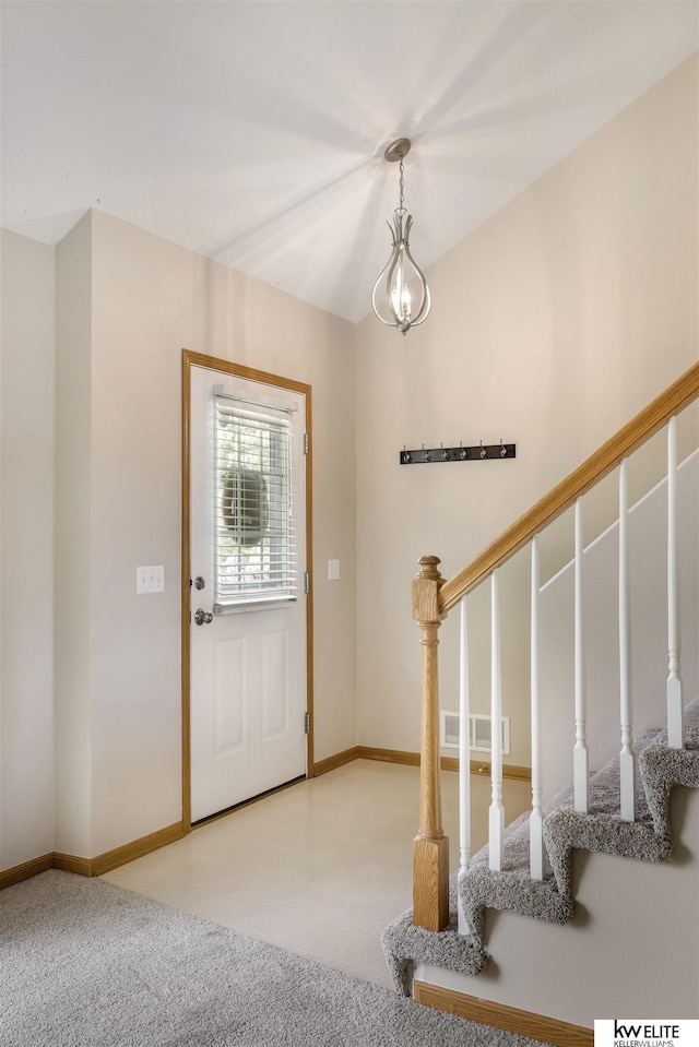 3015 N 144th Ter, Omaha, NE 68116 - carpeted foyer featuring baseboards and stairs