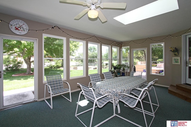 2600 Evergreen Cir, Beatrice, NE 68310 - sunroom with a skylight, carpet floors, and baseboards
