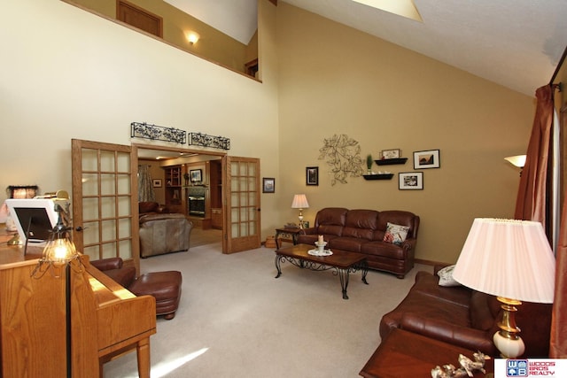 2600 Evergreen Cir, Beatrice, NE 68310 - living room with french doors, high vaulted ceiling, and carpet