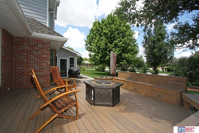 2600 Evergreen Cir, Beatrice, NE 68310 - wooden terrace featuring a fire pit