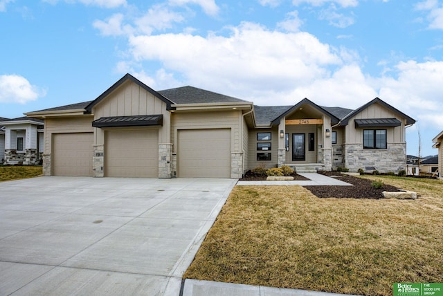 3639 S 218th Ave, Elkhorn, NE 68022 - view of front of home featuring board and batten siding, stone siding, an attached garage, and a front lawn