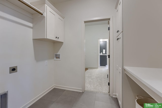 3639 S 218th Ave, Elkhorn, NE 68022 - washroom featuring hookup for an electric dryer, cabinet space, hookup for a washing machine, tile patterned floors, and baseboards