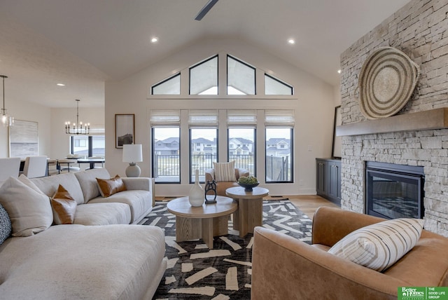 3639 S 218th Ave, Elkhorn, NE 68022 - living area featuring a chandelier, lofted ceiling, a fireplace, recessed lighting, and light wood finished floors