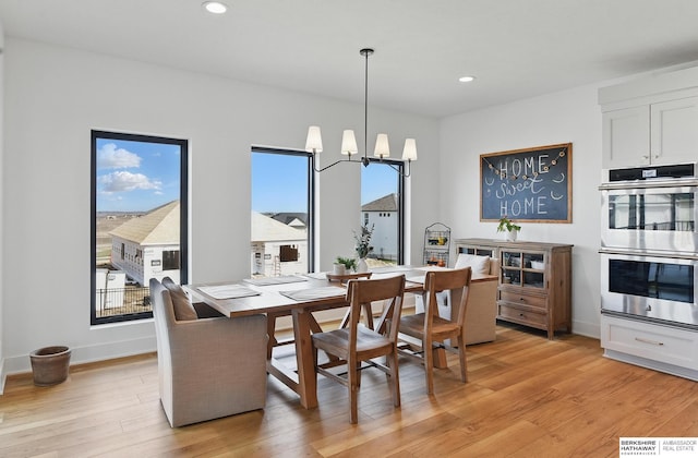 11065 N 171st St, Bennington, NE 68007 - dining area with light wood-style floors, recessed lighting, a chandelier, and baseboards