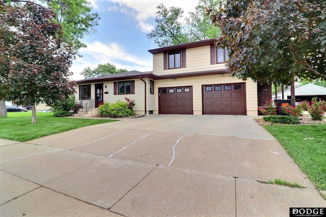 2036-2042 N Somers Ave, Fremont, NE 68025 - tri-level home with an attached garage, driveway, and a front lawn