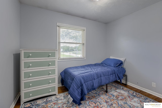12180 Pedersen Dr, Omaha, NE 68144 - bedroom featuring wood finished floors and baseboards