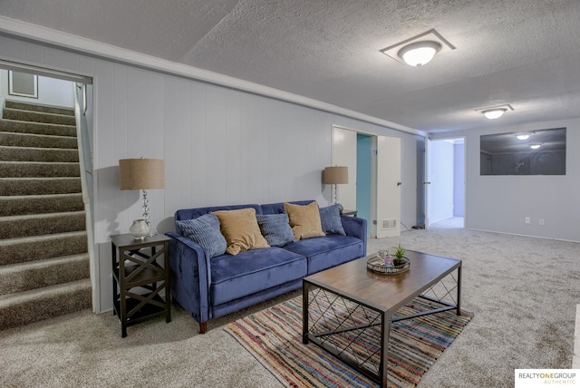 12180 Pedersen Dr, Omaha, NE 68144 - carpeted living room with stairs and a textured ceiling