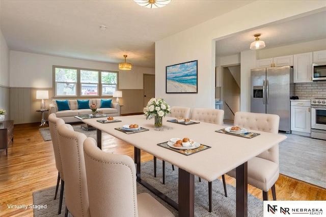 8261 Stephanie Ln, Bellevue, NE 68147 - dining space with light wood-style floors