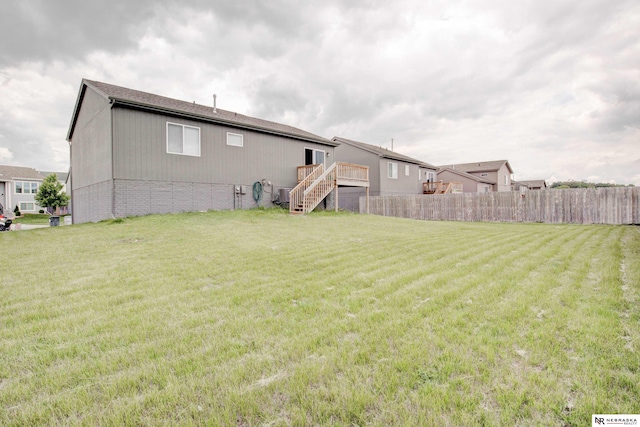 7707 N 88th St, Omaha, NE 68122 - rear view of house featuring stairway and a wooden deck
