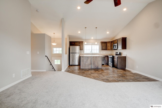 7707 N 88th St, Omaha, NE 68122 - kitchen featuring appliances with stainless steel finishes, a sink, a center island, light colored carpet, and recessed lighting