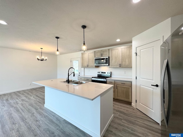 929 S Columbia Ave, Seward, NE 68434 - kitchen featuring appliances with stainless steel finishes, a sink, recessed lighting, dark wood-style flooring, and a chandelier