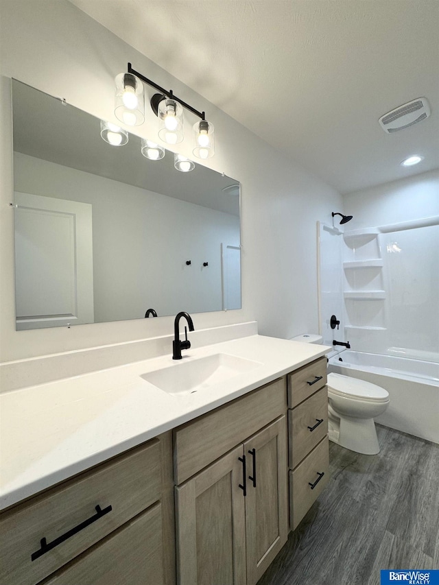 929 S Columbia Ave, Seward, NE 68434 - full bathroom with wood finished floors, vanity, toilet, and tub / shower combination