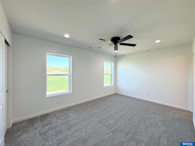 929 S Columbia Ave, Seward, NE 68434 - spare room featuring recessed lighting, dark carpet, baseboards, and ceiling fan