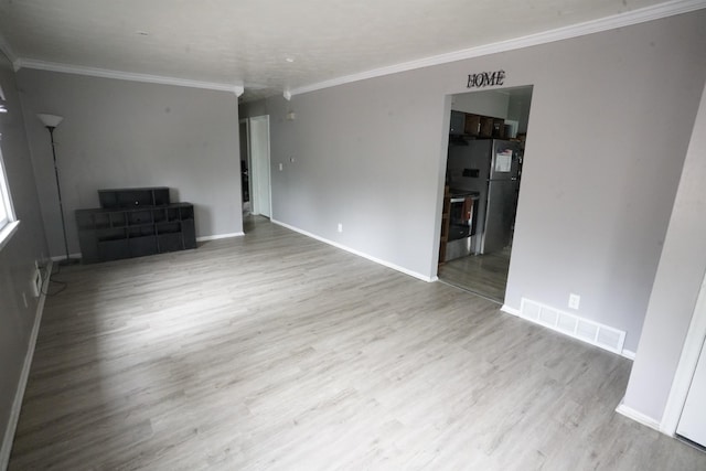 5433 N 45th Ave, Omaha, NE 68104 - unfurnished living room featuring wood finished floors, ornamental molding, and baseboards