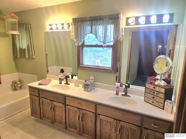 2205 Hidden Canyon Rd, Plattsmouth, NE 68048 - bathroom featuring double vanity and a bath
