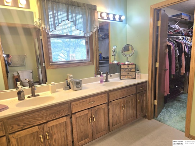 2205 Hidden Canyon Rd, Plattsmouth, NE 68048 - full bath featuring double vanity, a spacious closet, and toilet