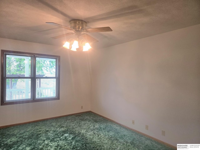 2205 Hidden Canyon Rd, Plattsmouth, NE 68048 - spare room featuring a ceiling fan, carpet flooring, a textured ceiling, and baseboards