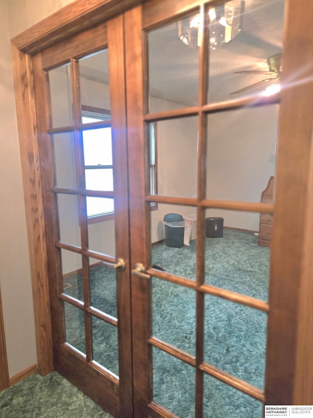 2205 Hidden Canyon Rd, Plattsmouth, NE 68048 - detailed view of french doors, carpet flooring, and a ceiling fan