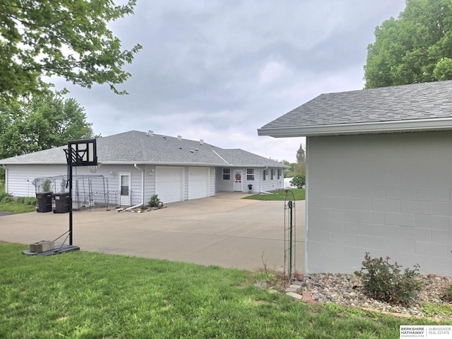 2205 Hidden Canyon Rd, Plattsmouth, NE 68048 - view of parking with concrete driveway and an attached garage