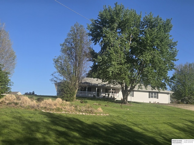 2205 Hidden Canyon Rd, Plattsmouth, NE 68048 - view of front of property with a front yard and covered porch
