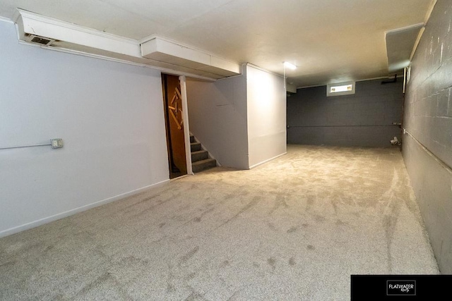 4518 Redick Ave, Omaha, NE 68152 - below grade area with stairs, carpet, and concrete block wall