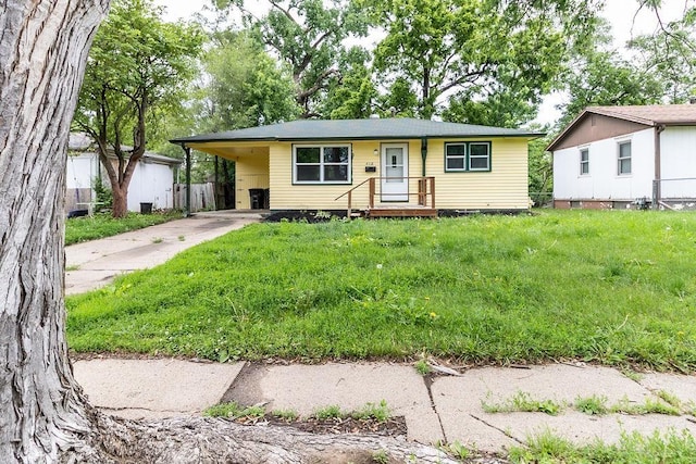 4518 Redick Ave, Omaha, NE 68152 - view of front of home featuring driveway, an attached carport, and a front lawn