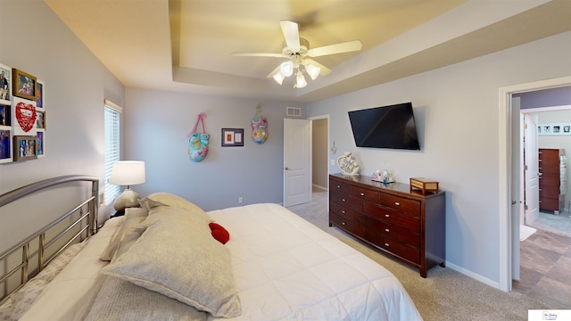 1609 N 208th St, Elkhorn, NE 68022 - carpeted bedroom featuring a raised ceiling, baseboards, and ceiling fan