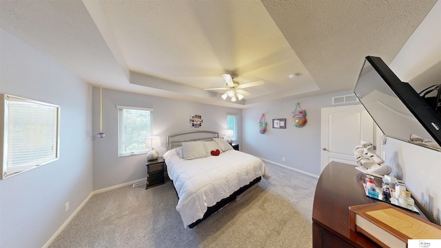 1609 N 208th St, Elkhorn, NE 68022 - bedroom with a raised ceiling, light colored carpet, baseboards, a textured ceiling, and ceiling fan