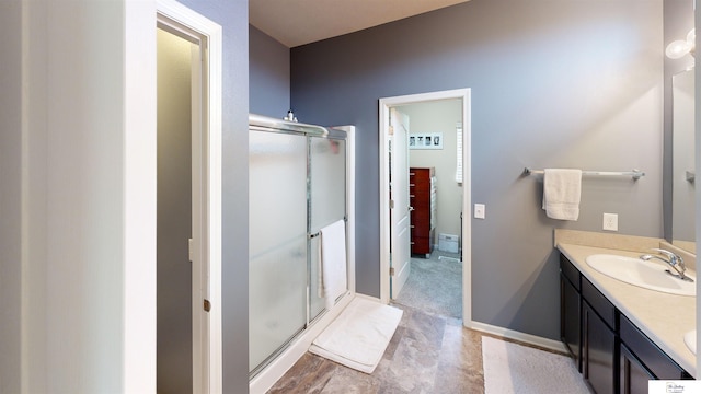1609 N 208th St, Elkhorn, NE 68022 - bathroom featuring a shower stall, vanity, and baseboards