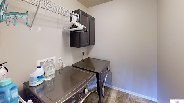 1609 N 208th St, Elkhorn, NE 68022 - washroom with cabinet space, washing machine and dryer, and baseboards