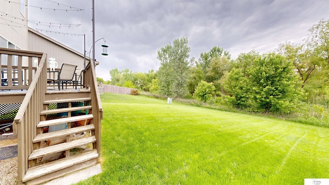1609 N 208th St, Elkhorn, NE 68022 - view of green lawn featuring a deck and stairway