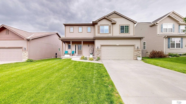 1609 N 208th St, Elkhorn, NE 68022 - view of front of home with stone siding, concrete driveway, a front yard, covered porch, and a garage