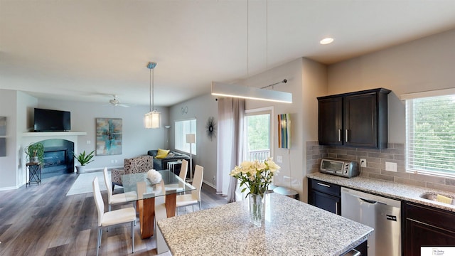 1609 N 208th St, Elkhorn, NE 68022 - kitchen with dishwasher, open floor plan, healthy amount of natural light, dark brown cabinets, and recessed lighting
