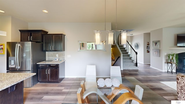 1609 N 208th St, Elkhorn, NE 68022 - dining area with light wood-type flooring, stairway, recessed lighting, and baseboards