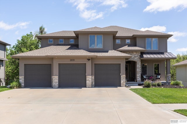 2203 N 188th Ave, Elkhorn, NE 68022 - prairie-style house with concrete driveway, stone siding, roof with shingles, and a porch