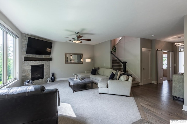 2203 N 188th Ave, Elkhorn, NE 68022 - living area with stairs, a ceiling fan, a barn door, baseboards, and wood finished floors