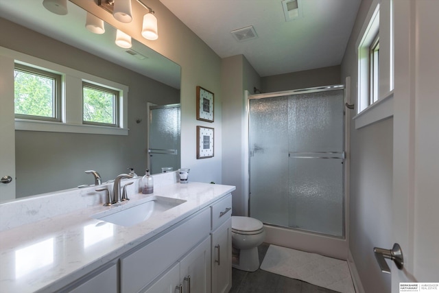 2203 N 188th Ave, Elkhorn, NE 68022 - bathroom with vanity, a stall shower, and toilet