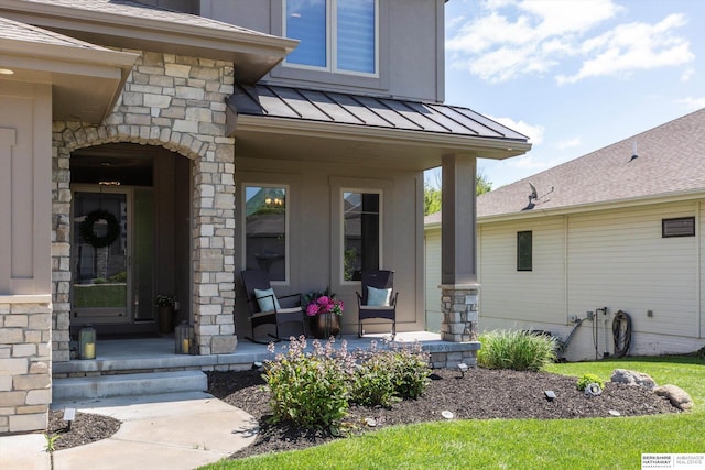 2203 N 188th Ave, Elkhorn, NE 68022 - view of exterior entry with covered porch, a standing seam roof, stone siding, and metal roof