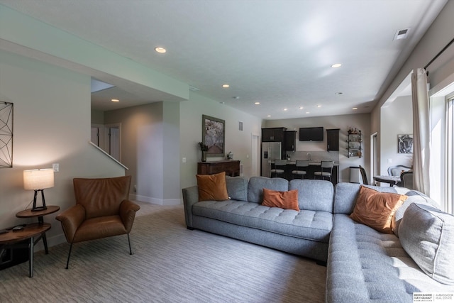 2203 N 188th Ave, Elkhorn, NE 68022 - living area with light colored carpet, baseboards, and recessed lighting